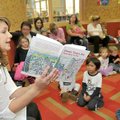 Shelli Rushing with the Bentonville Planning Office read to a group of children at the Bentonville P...
