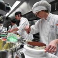 Ruth Pahmiyer, 18, of Lincoln iced a chocolate cake she made while doing a demo in class on Wednesda...