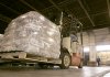 Workers load pallets of rice into trucks at a Little Rock warehouse Oct. 28, 2009. The economy grew at a 3.5 percent pace in the third quarter, the best showing in two years, fueled by government-supported spending on cars and homes. 