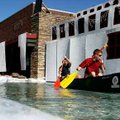 University of Arkansas sophomores Trent Roberts (left) and Jay Piering paddle a canoe in a makeshift...