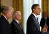 President Barack Obama is accompanied Wednesday by Defense Secretary Robert Gates and Vice President Joe Biden as he speaks at the White House in Washington before signing the National Defense Authorization Act.