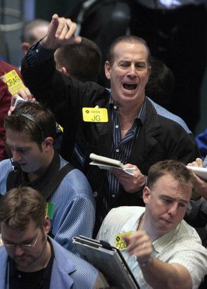 Oil traders work in the options pit on the floor of the New York Mercantile Exchange on Wednesday.