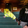 Ron Sparks, chief of railroad police with the Arkansas & Missouri Railroad, inspects railroad cars a...