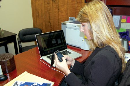 jessica-norris-director-of-communications-for-bryant-schools-uses-her-iphone-to-compose-a-message-to-test-the-bryant-school-districts-txtwire-emergency-text-messaging-system-parents-teachers-and-students-can-subscribe-to-the-text-messaging-system-to-receive-instant-notices-on-their-cell-phones-about-school-closings-due-to-inclement-weather-or-instructions-during-crisis-situations