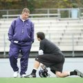 Fayetteville coach Daryl Patton speaks with junior quarterback Brandon Allen during a break in the D...