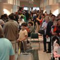 Hundreds of people line up for flu shots Thursday at the Jones Center for Families in Springdale. Th...