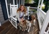Denise Holmes and her dogs Henri and Chelsea sit on her friends porch in Fayetteville, her favorite space.