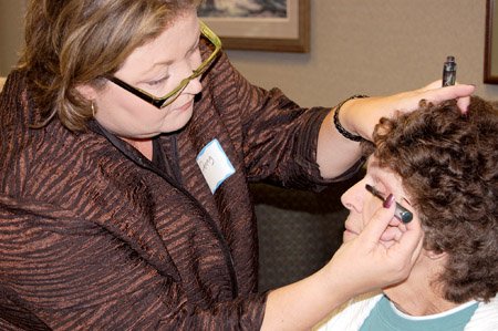 cameron-johnson-of-franklin-receives-a-makeover-as-penny-clayton-licensed-cosmetologist-demonstrates-proper-makeup-application-johnson-is-undergoing-cancer-treatment-and-participated-in-the-look-good-feel-better-workshop-at-white-river-medical-center-cancer-care-center-on-monday-below-a-collection-of-wigs-scarves-and-turbans-are-available-for-the-participants-of-the-look-good-feel-better-program-to-try-on-and-take-home