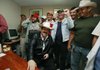 Honduran President Manuel Zelaya (seated) and supporters celebrate Friday in Tegucigalpa at the Brazilian Embassy, which has been his refuge since Sept. 21.