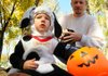 Jackson Brent, 2, attended the Howl-O-Ween dressed as a Dalmatian at Murphy Dog Park in Rogers on Saturday. At right is Jackson’s father, Michael Brent. 