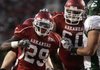 Arkansas' Broderick Green gets a pat on the head from teammate Seth Oxner after scoring a touchdown against Eastern Michigan on Saturday at Reynolds Razorback Stadium in Fayetteville.