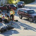 Fayetteville police and fire and Central EMS personnel attend to one of two riders of a Yamaha motor...