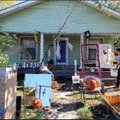 Keith Hyers puts the finishing touches Saturday on creating his haunted house for Halloween at his h...