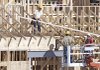 Workers assemble the roof on a new commercial building in Warrensville Heights, Ohio, in September. The Commerce Department said Monday that construction spending rose in September.