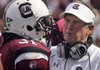 South Carolina's Steve Spurrier (right) talks to running back Kenny Miles (31) during the second half of an NCAA college football game against Kentucky on Saturday at Williams Brice Stadium in Columbia, S.C.