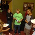 Dean Martinez, left, and Jay Gresham, right, of Big House Youth Outreach, talk with Jonathan Savan, ...
