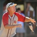 Dave Van Horn, baseball coach at the University of Arkansas, watches Sunday as a ball sails to the o...