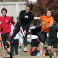 Ultimate interception 
Arkansas junior Matt Jackson loses his hat as he jumps to intercept a disc m...