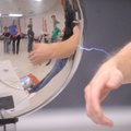 Matt McKnight, a senior University of Arkansas physics student from Fort Smith, demonstrates the pow...