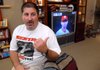 Mark Balisterri, the high school baseball coach for Cliff Lee, watches Lee pitch in the World Series on Monday night. Lee, who is from Benton pitched against A.J. Burnett who is from North Little Rock.