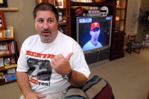 Mark Balisterri, the high school baseball coach for Cliff Lee, watches Lee pitch in the World Series on Monday night. Lee, who is from Benton pitched against A.J. Burnett who is from North Little Rock.
