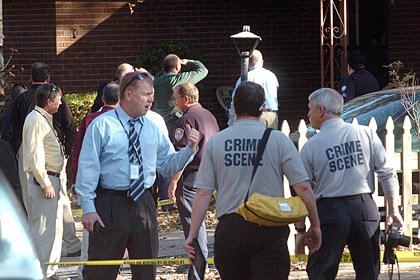 authorities-stand-outside-5915-carlyle-drive-after-an-officer-involved-shooting-there-tuesday