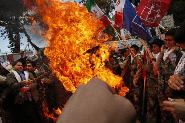 male-iranian-school-students-who-are-members-of-basij-militia-which-is-a-unit-of-the-revolutionary-guard-burn-a-us-flag-in-an-annual-demonstration-in-front-of-the-former-us-embassy-in-tehran-iran-wednesday