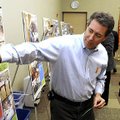 Todd Frank votes with a green dot for basketball courts Tuesday in a future Bentonville Community Ce...