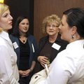 Businesswomen Sara Gregory, from left, Amber Kramer, Beverly Heitzman and Angie Madigan talk Tuesday...