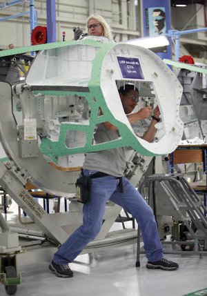 Virginia Boyd and Johnney Watson work last summer
on a cockpit on the F-35 Lightning II assembly line at Lockheed
Martin Aeronautics Co. in Fort Worth.