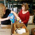 Shannan Lowe (left) and Bette Tatum, both with First Baptist Church of Lowell, select food Tuesday f...