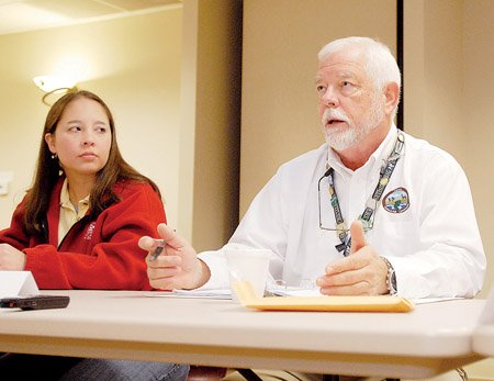corps-of-engineers-representative-danacoburn-listens-to-mark-oliver-of-the-arkansas-game-and-fish-commission-talk-about-funding-a-watershed-study-on-lake-conway