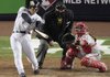 World Series MVP Hideki Matsui watches the flight of his two-run double in the fifth inning of a 7-3 victory over Philadelphia, giving the Yankees their 27th World Series title, the most by any major league team. Matsui had 3 hits in 4 plate appearances and drove in 6 runs, batting .615 in the series.