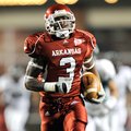 Arkansas wide receiver Joe Adams races for the end zone for a touchdown during the third quarter Sat...