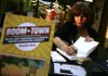 Marjorie Rosen signs copies of her book Boom Town: How Wal-Mart Transformed an All-American Town into an International Community after speaking Wednesday at the University of Arkansas at Fayetteville Multicultural Center inside the Arkansas Union.

