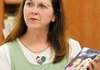 Olivia Olson, a resource teacher at Mathias Elementary School in Rogers, speaks Wednesday about the book she wrote, “Eva’s Gift.”
