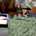University of Arkansas at Fayetteville graduate student Andrew Warren monitors traffic Wednesday wit...