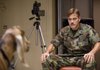 Psychic warrior Lyn Cassady (George Clooney) attempts to do some serious damage to a helpless caprine subject in the military farce The Men Who Stare at Goats. 