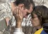 Christopher Craig, brother of Fort Hood shooting victim Pfc. Michael Pearson, grieves with a neighbor Friday at the Pearson family’s home in Bolingbrook, Ill.