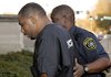 Curtis Lavelle Vance is escorted into the courthouse Friday for resumption of his murder trial.
