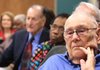 AARP members including James Smalley (right) watch the national AARP teleconference from Little Rock on Thursday, when the group endorsed House legislation on health care. 