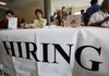 Job recruiters wait for applicants Wednesday at a job fair at Skyline College in San Bruno, Calif. 