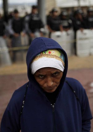 A woman attends a protest Thursday in Tegucigalpa, Honduras, demanding that Honduras’ ousted President Manuel Zelaya be returned to power.