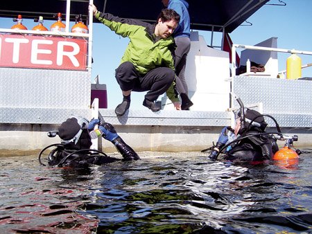 rian-howard-of-cabot-top-helps-marc-johnson-of-little-rock-left-and-his-son-chris-stay-hydrated-in-between-dives
