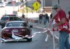 Allen Bayley, with the University of Arkansas Athletic Department, puts up a barrier around Razorback Stadium on Friday afternoon in Fayeteville as crews prepare for Arkansas game against the South Carolina Gamecocks this Saturday. 