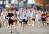 Frank Arellano, center, of Rogers leads the pack Saturday at the start of the Veterans Memorial 5K Run at Fayetteville National Cemetery. Arellano went on to win the inaugural event in a time of 17:44. The race was organized as a fundrasier for the Regional National Cemetery Improvement Corporation.