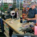 Bobby Bollinger of Van Buren buys a handful of lottery tickets Friday at the Grand Slam store in Poc...