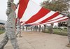 Soldiers fold an American flag Monday at Fort Hood near Killeen, Texas, in preparation for President Barack Obama’s planned visit to the base today.