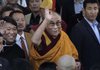 Tibetan spiritual leader the Dalai Lama and Arunachal Pradesh state Chief Minister Dorjee Khandu (left) wave to media as they arrive at the Tawang monastery in Tawang in northeastern India Sunday.