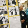 Sarah Russell (left) and her niece Deloris Peacy look over historical photos of Tontitown during the...